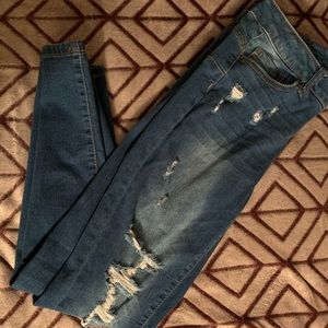 Ripped dark blue jeans